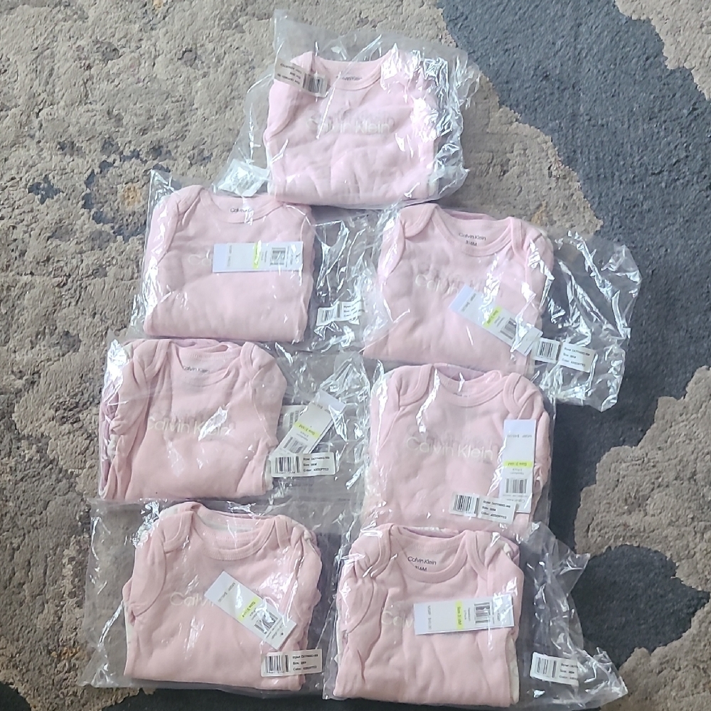 Calvin Klein Soft Pink Baby Onesies Collection